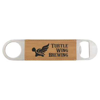 Custom engraved bamboo speed opener with 'Turtle Wing Brewing' logo on a white background
