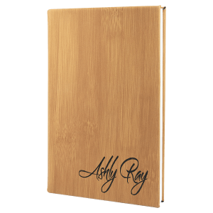 Custom laser-engraved Bamboo leatherette journal featuring the name Ashley Ray for a professional, personalized look.