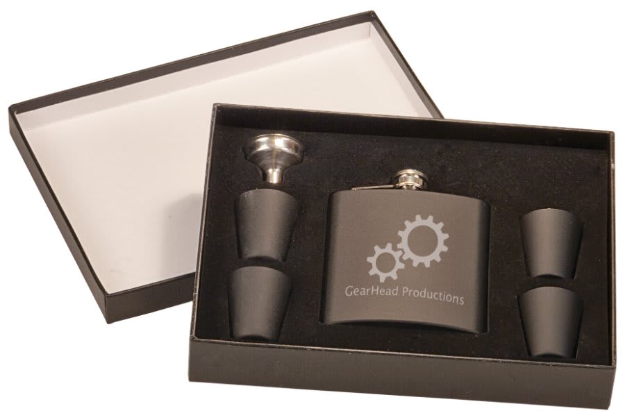 Custom matte black 6 oz. stainless steel flask gift set featuring a gear design, includes four shot glasses and a funnel in a black presentation box.