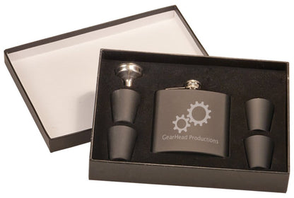 Custom matte black 6 oz. stainless steel flask gift set featuring a gear design, includes four shot glasses and a funnel in a black presentation box.