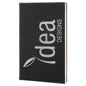 Custom laser-engraved Black leatherette journal with silver engraving featuring a Idea Designs logo for a professional, personalized look.