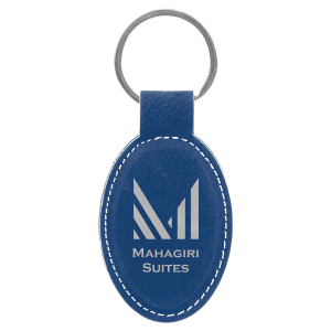 Blue oval keychain with silver  engraved 'Mahagiri Suites' logo on a white background