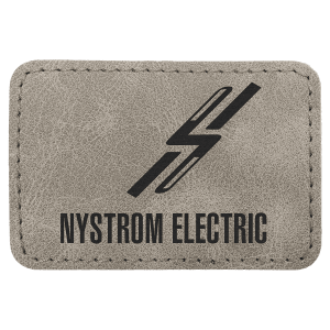 A rectangular gray textured leatherette patch with stitched edges, featuring a black stylized lightning bolt and the text 'NYSTROM ELECTRIC' printed in black.