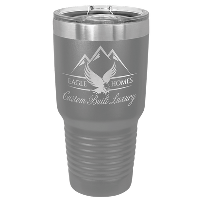 Custom laser-engraved 30 oz grey insulated tumbler featuring 'Eagle Homes Custom Built Luxury' logo, shown on a transparent background.