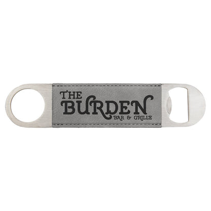 Custom engraved grey leatherette speed opener with 'The Burden Bar & Grille' branding on a white background
