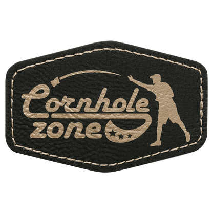 Black and gold patch with 'Cornhole Zone' text and silhouette of a person playing cornhole.