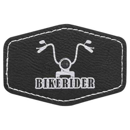 Black leatherette hexagon patch with stitched edges, featuring a motorcycle graphic and the text 'BIKERIDER'.