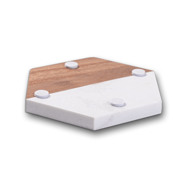 Underside of a hexagon marble and acacia wood coaster showing protective non-slip feet pads on a transparent background.
