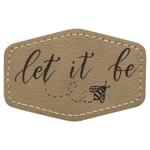 A light brown leatherette hexagon patch with stitched edges, featuring the text "let it be" in script lettering and a small bee illustration with a dotted flight trail.