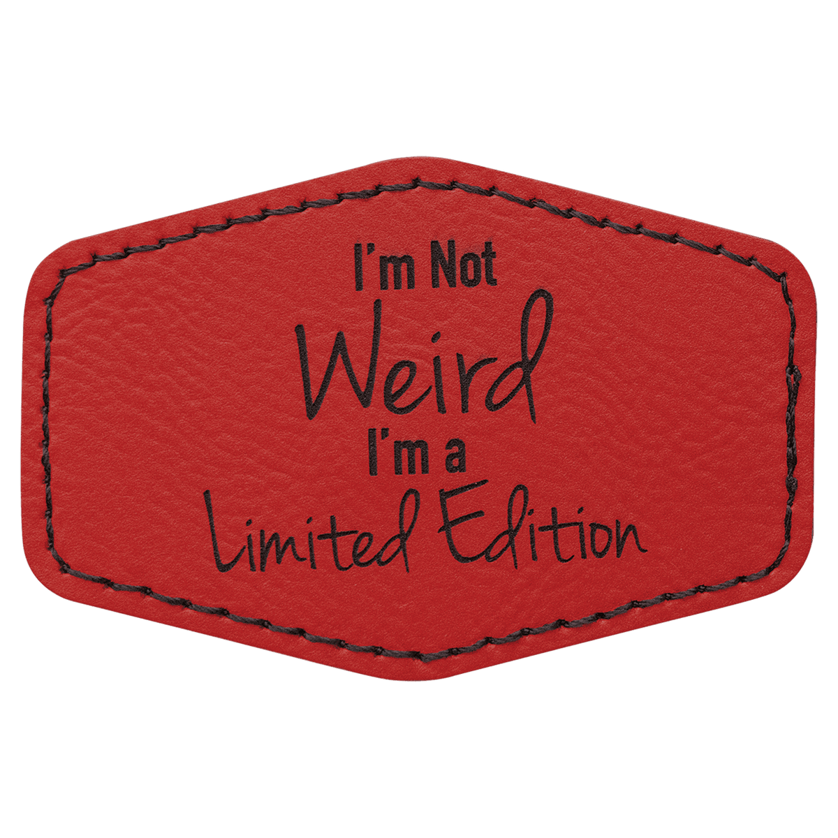 A red leatherette hexagon patch with black stitched edges, featuring the text "I'm Not Weird I'm a Limited Edition" in a mix of block and script lettering.