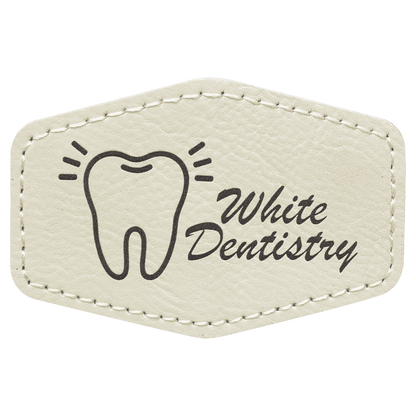 A white/beige leatherette hexagon patch with black stitched edges, featuring a black laser-engraved tooth illustration and the text 'White Dentistry'.