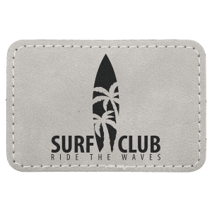 A rectangular light gray leatherette patch with stitched edges, featuring a black surfboard silhouette with palm tree leaves and the text 'SURF CLUB' and 'RIDE THE WAVES'.
