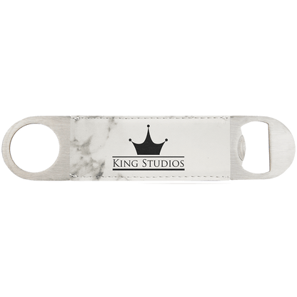 Custom engraved marble-patterned leatherette speed opener with 'King Studios' logo on a white background