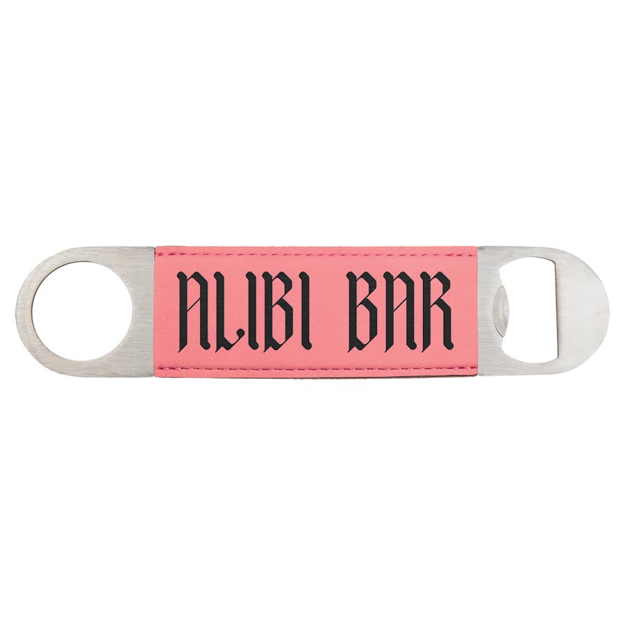 Custom engraved pink leatherette speed opener with 'ALIBI BAR' text on a white background