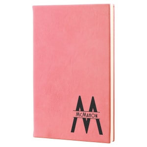 Custom laser-engraved Pink leatherette journal featuring the monogram M with McMahon through the letter for a professional, personalized look.