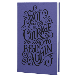 Custom laser-engraved Purple leatherette journal featuring a whimsical design with swirls that says 'You have the courage to begin again.'