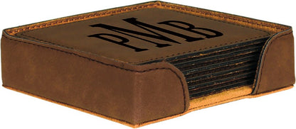 A dark brown leatherette coaster set with a matching holder, featuring a monogrammed 'PMB' laser-engraved in a bold serif font on the top coaster.