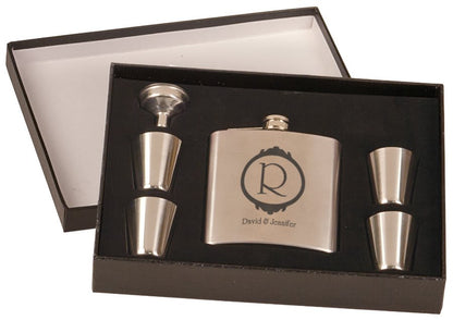 Custom 6 oz. stainless steel flask gift set featuring a circle with an elegant R in the center, with "David & Jennifer in a script font underneath. Includes four shot glasses and a funnel in a black presentation box.