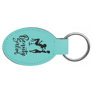 Turquoise oval keychain with black text "Beauty Salon" and silhouette on a white background