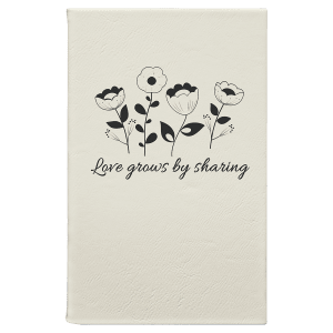 Custom laser-engraved White leatherette journal featuring wild flowers and the quote 'Love grows by sharing' for a lovely, personalized look.